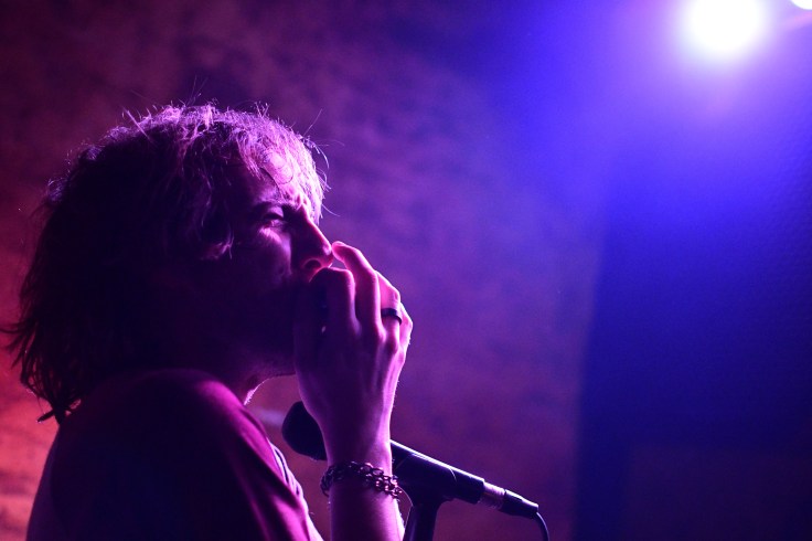 Carter Stellon of The Grimtones wailing on his harmonica at Third Street Bar in Reno, NV
